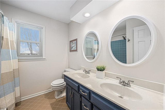 bathroom featuring baseboards, a sink, toilet, and tile patterned floors