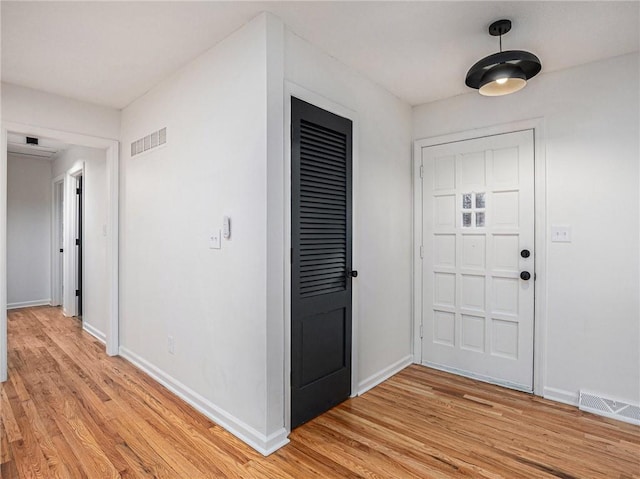 foyer with light hardwood / wood-style flooring