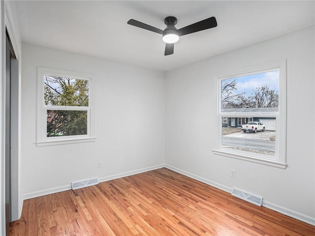 unfurnished room with ceiling fan and light hardwood / wood-style flooring