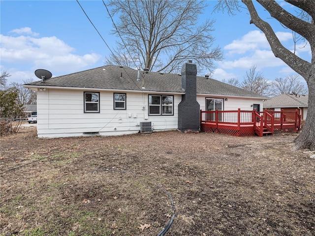 back of property featuring central AC unit and a deck