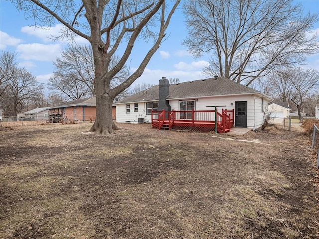 back of property with a wooden deck