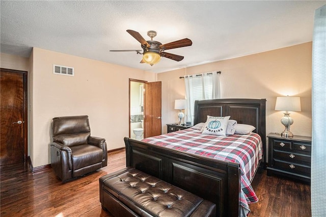 bedroom featuring hardwood / wood-style flooring, ceiling fan, and connected bathroom