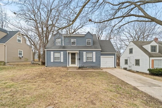 cape cod-style house with cooling unit, a garage, and a front yard