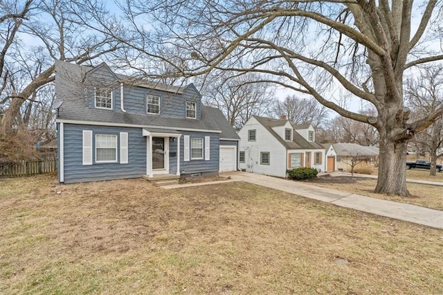 cape cod-style house with a garage and a front lawn