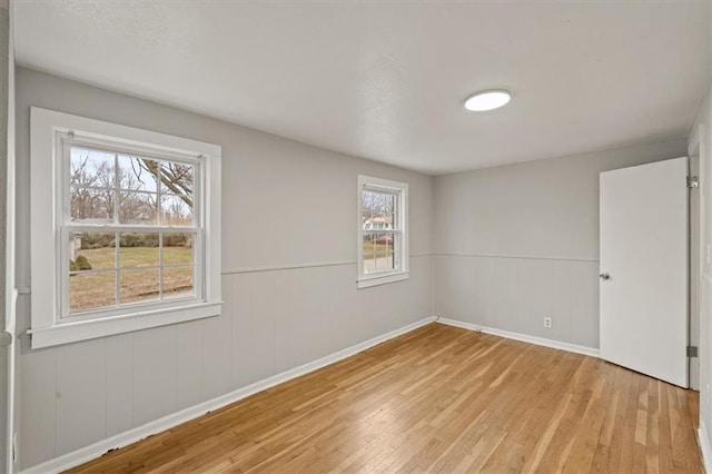 unfurnished room featuring light hardwood / wood-style flooring