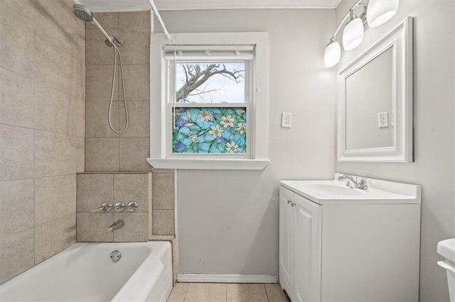 full bathroom featuring tiled shower / bath combo, vanity, tile patterned floors, and toilet