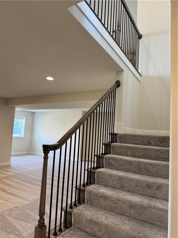 25297 W 149th Ter, Olathe, KS 66061 - staircase featuring baseboards, carpet floors, and recessed lighting