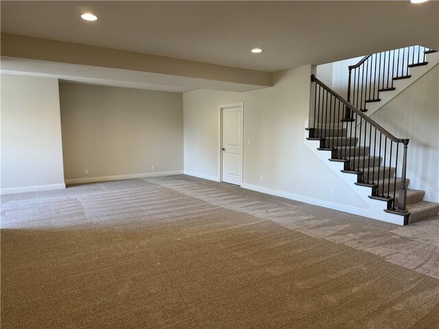 25297 W 149th Ter, Olathe, KS 66061 - unfurnished living room with carpet floors, baseboards, and recessed lighting
