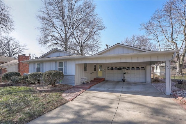 ranch-style house featuring concrete driveway, brick siding, board and batten siding, and an attached garage