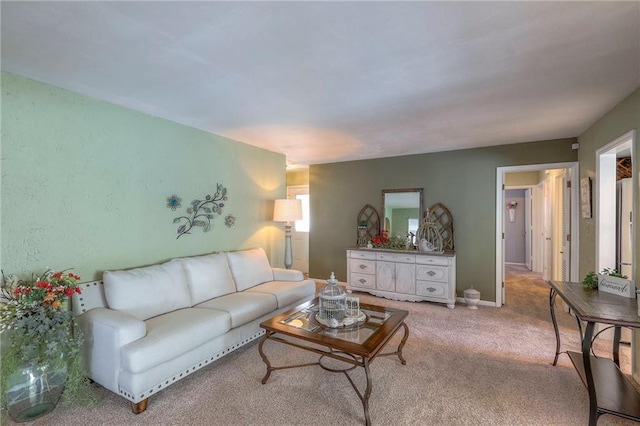 living room with light carpet and baseboards