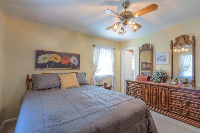 carpeted bedroom with a ceiling fan