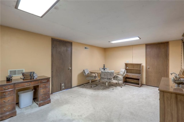 office area with light carpet and visible vents