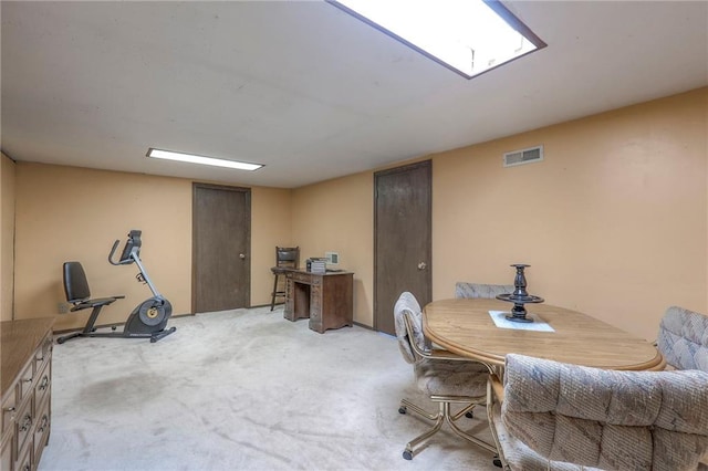 dining area featuring light carpet and visible vents