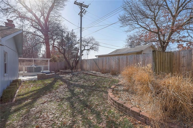 view of yard featuring a fenced backyard and a pergola