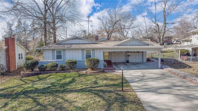 view of front of property with a garage, concrete driveway, a front lawn, board and batten siding, and brick siding