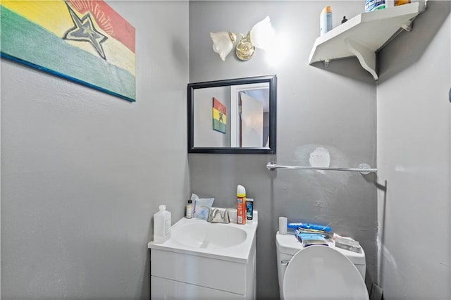 bathroom with vanity and toilet