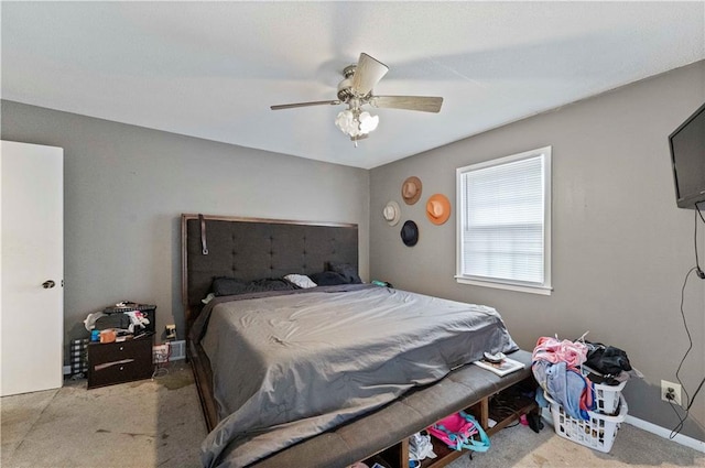 bedroom featuring ceiling fan and baseboards