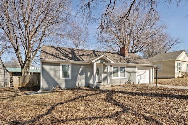 single story home with a garage, fence, concrete driveway, roof with shingles, and a chimney