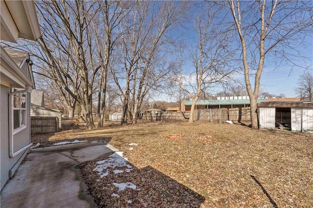 view of yard featuring an outdoor structure and a fenced backyard