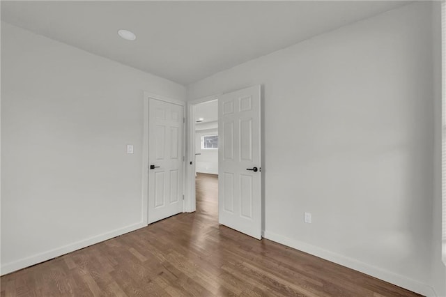 unfurnished room featuring wood-type flooring