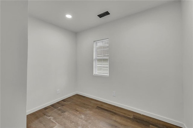 empty room featuring wood-type flooring