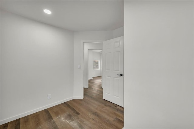 spare room featuring dark hardwood / wood-style floors