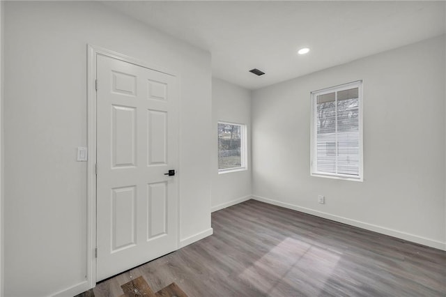 spare room featuring hardwood / wood-style flooring