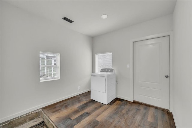 laundry room featuring washer / dryer and dark hardwood / wood-style floors