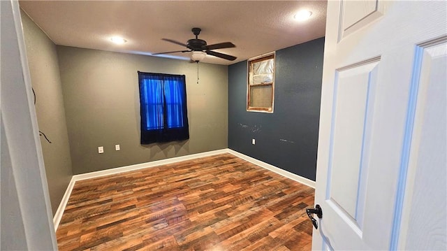 unfurnished room with hardwood / wood-style flooring and ceiling fan