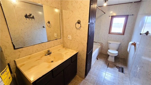 bathroom featuring vanity, a bathtub, and toilet