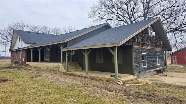 exterior space featuring cooling unit, a yard, and a patio area