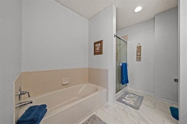 full bathroom with baseboards, a stall shower, a textured ceiling, a bath, and marble finish floor