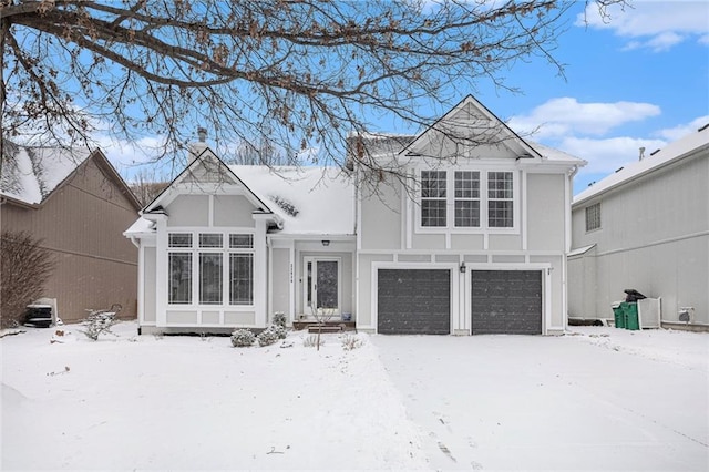 view of front of home with an attached garage and stucco siding