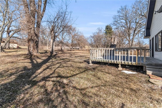 view of yard with a wooden deck