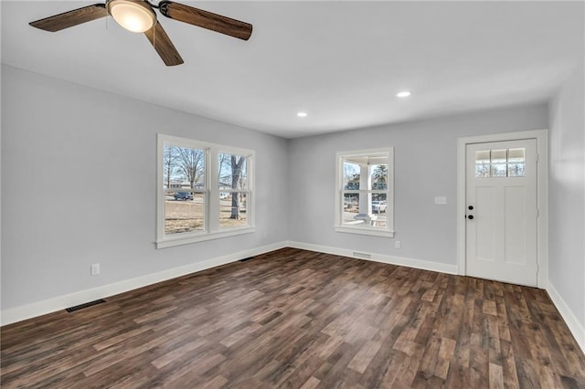 entrance foyer with dark wood-type flooring, recessed lighting, visible vents, and baseboards