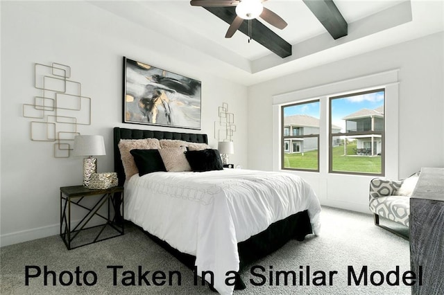 carpeted bedroom featuring beam ceiling and ceiling fan