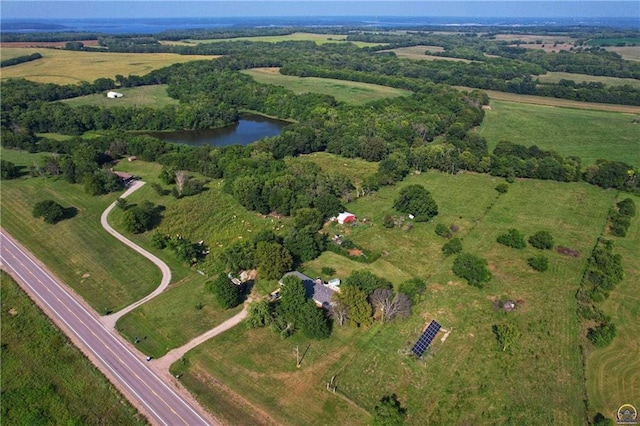 birds eye view of property featuring a rural view and a water view