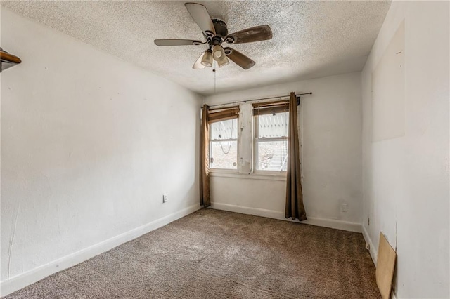 spare room with ceiling fan, carpet flooring, and a textured ceiling