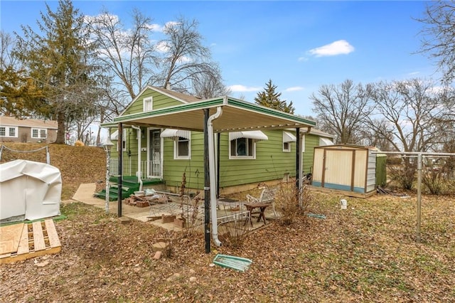 view of home's exterior with a storage shed