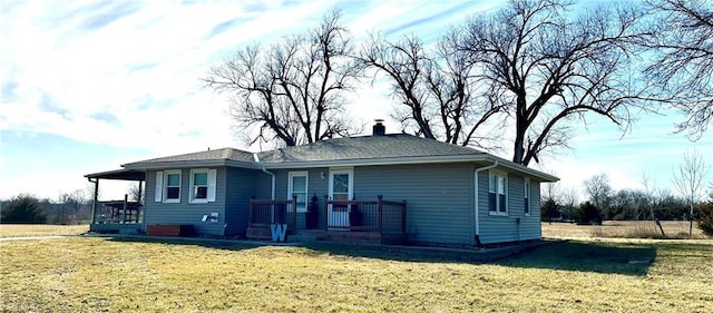 view of front of house with a chimney and a front yard