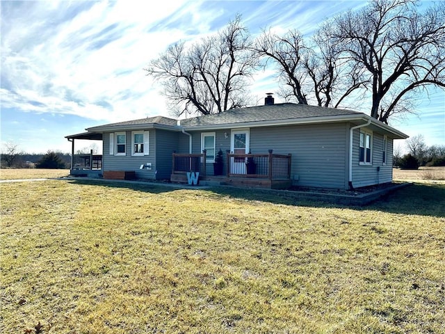 ranch-style home featuring a chimney and a front lawn