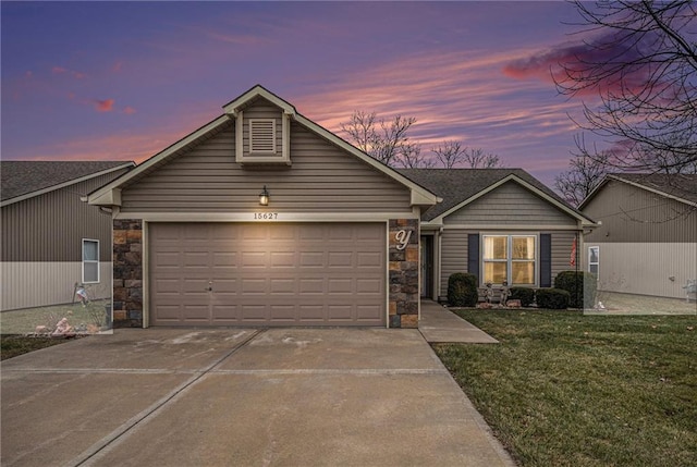 ranch-style house featuring a garage and a yard