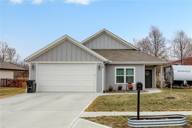 ranch-style home with a garage, concrete driveway, roof with shingles, a front lawn, and board and batten siding