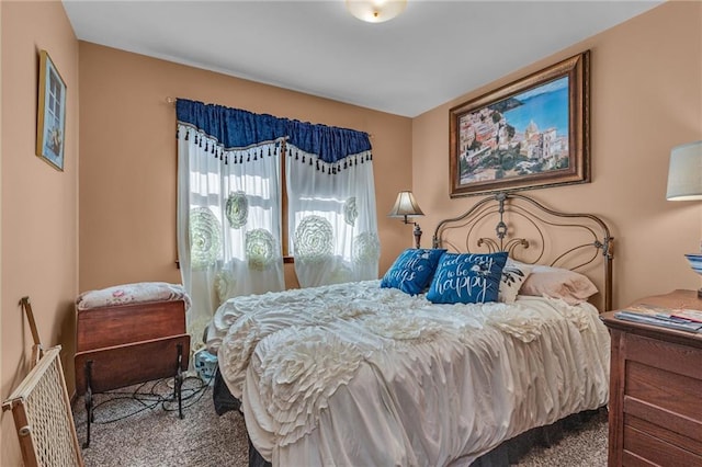 bedroom featuring carpet and radiator heating unit