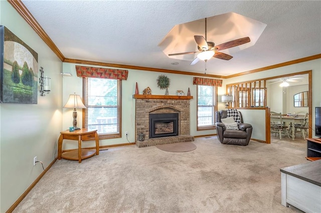 3812 SW Windemere Dr, Lees Summit, MO 64082 - carpeted living area featuring ceiling fan, ornamental molding, plenty of natural light, a textured ceiling, and a brick fireplace