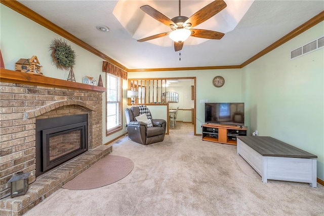 3812 SW Windemere Dr, Lees Summit, MO 64082 - living area with carpet floors, crown molding, a ceiling fan, and a fireplace