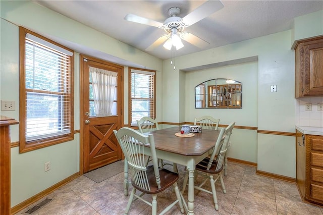 3812 SW Windemere Dr, Lees Summit, MO 64082 - dining area with ceiling fan and baseboards
