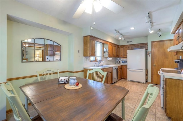 3812 SW Windemere Dr, Lees Summit, MO 64082 - dining room featuring ceiling fan, rail lighting, and light tile patterned flooring