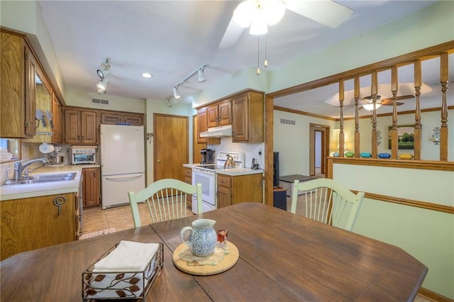 3812 SW Windemere Dr, Lees Summit, MO 64082 - dining area with a ceiling fan, rail lighting, and light tile patterned floors