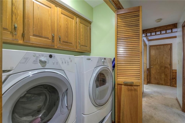 3812 SW Windemere Dr, Lees Summit, MO 64082 - laundry room featuring light carpet, cabinet space, and washing machine and dryer